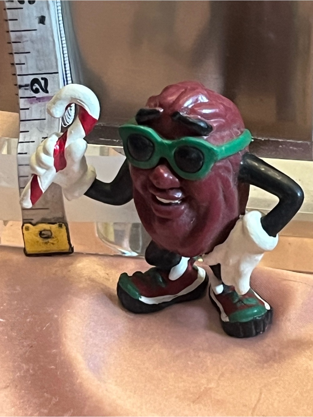 Burgundy Novelty Raisin Figurine with Green Sunglasses